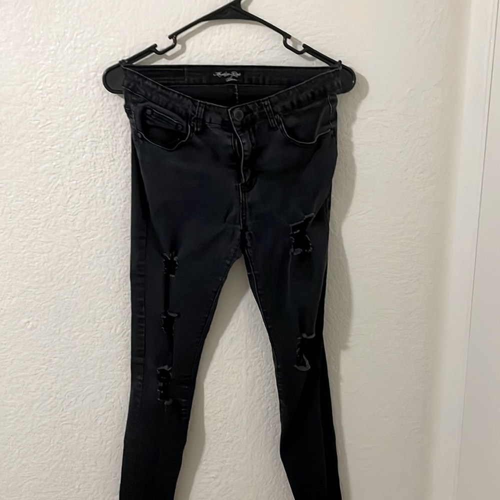 black ripped pants